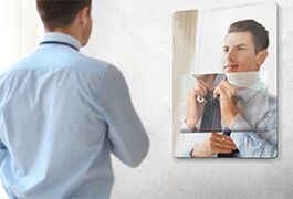 man tiying tie in smart mirror
